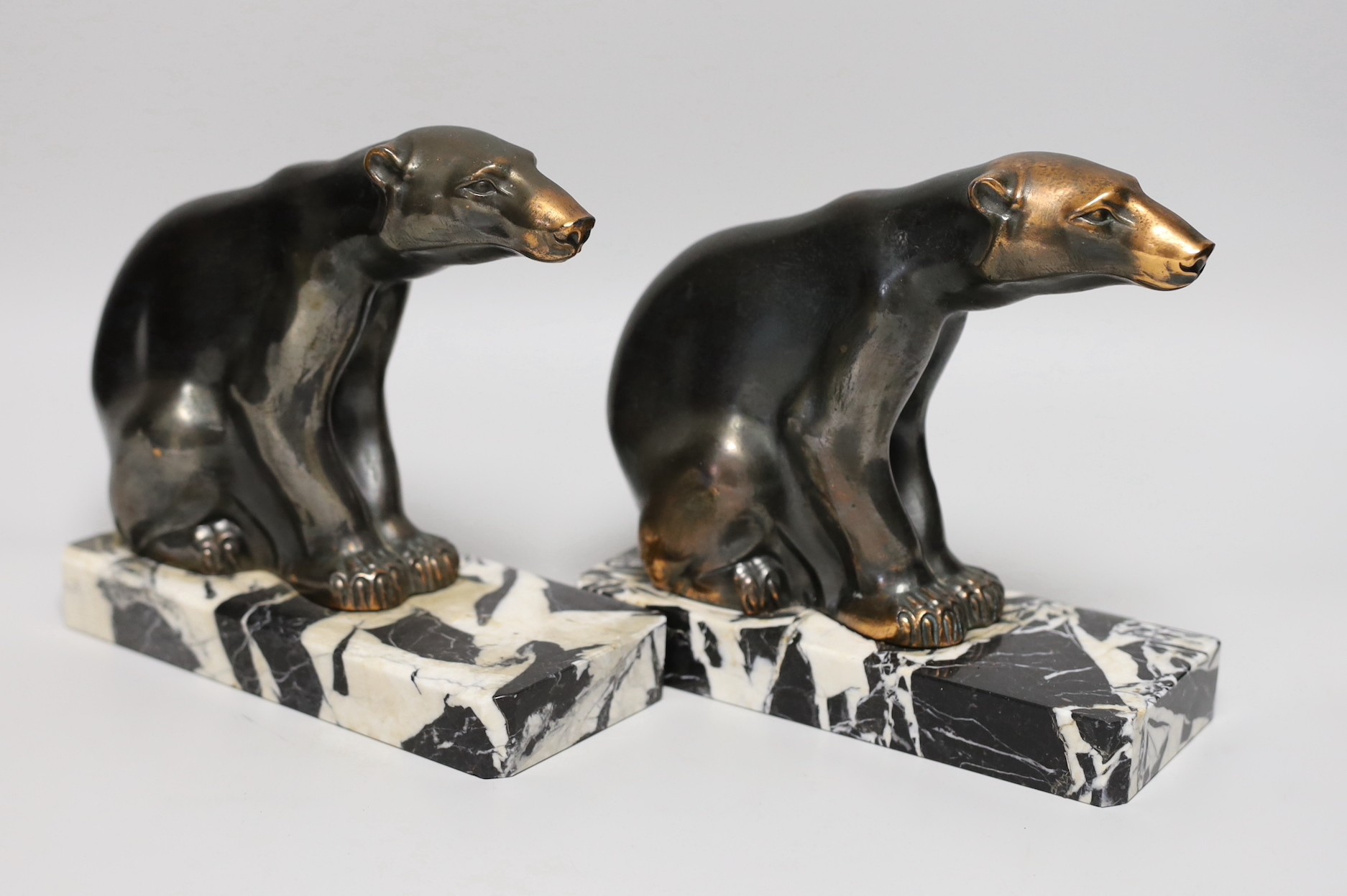 A pair of signed M. Font spelter polar bear bookends, 17cms high